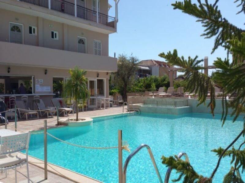 Happyland Hotel Apartments Нідрі Екстер'єр фото